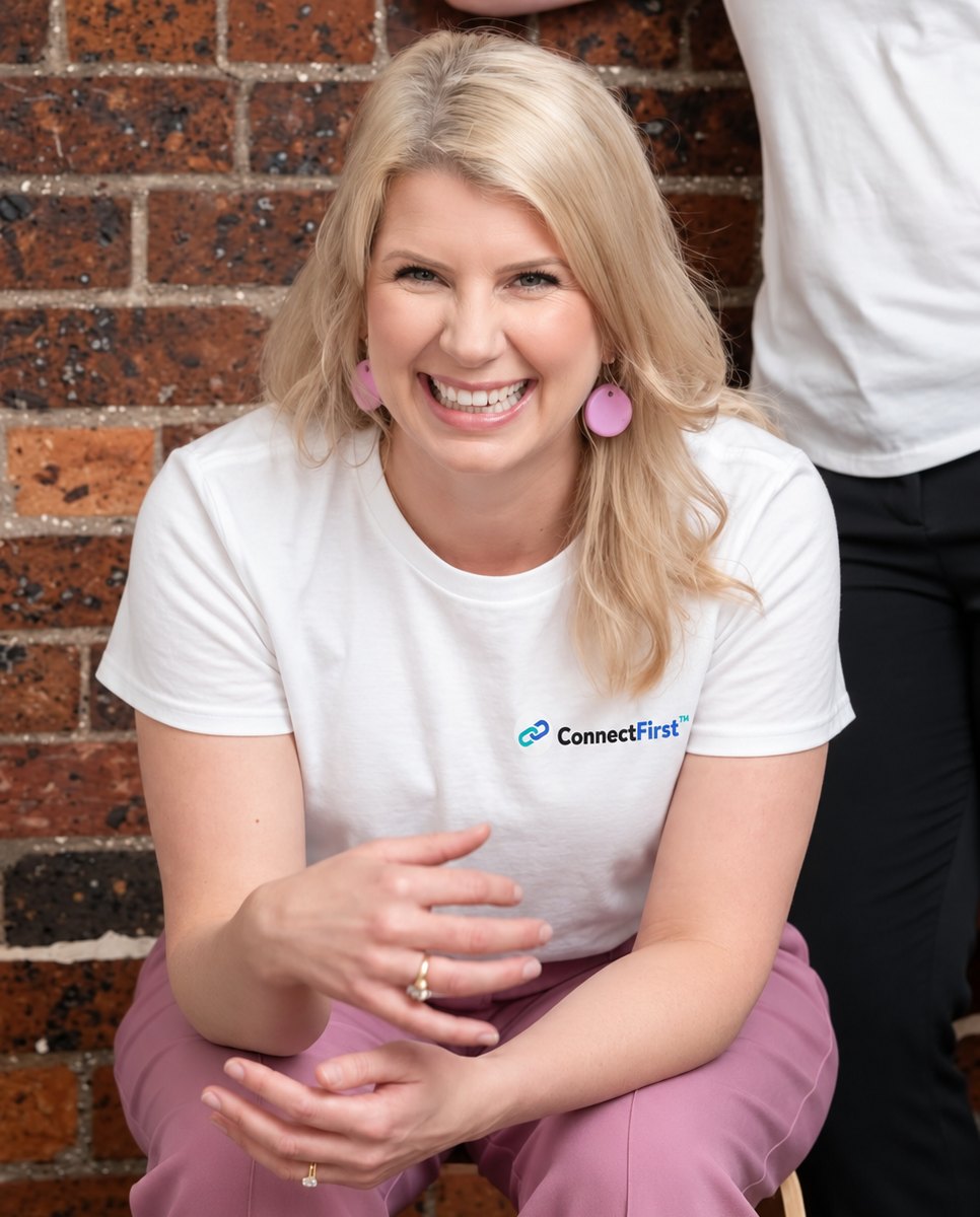 Meg Hughes, founder of ConnectFirst, in a ConnectFirst t-shirt